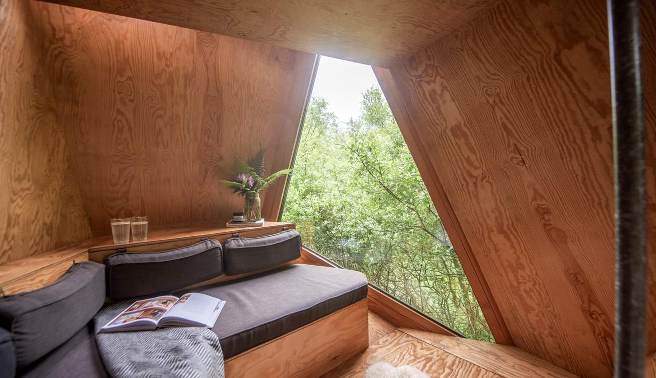 Relax in your treetop escape, with a book surrounded by nature.
