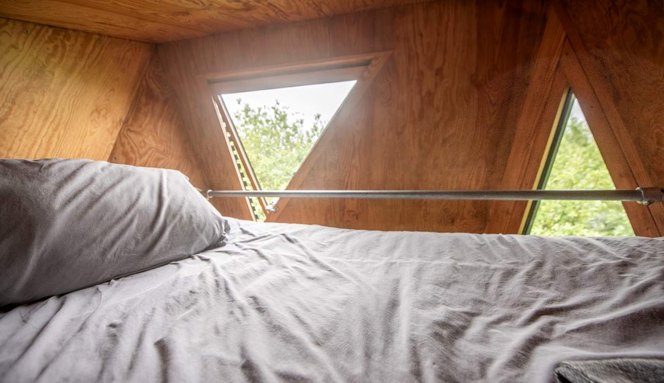 A cosy double bed to rest your head after a day of adventures.