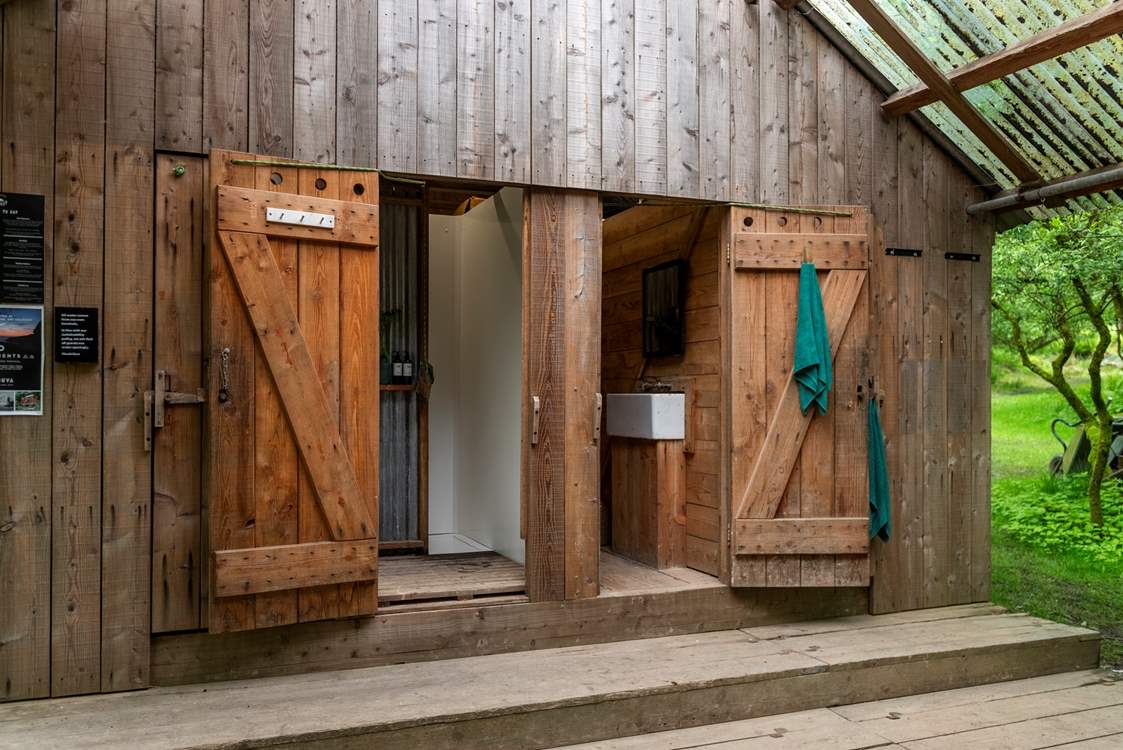 The shared showers and toilets can be found next to the communal kitchen.