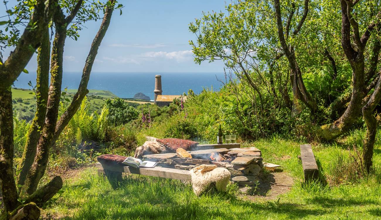 Relax around the communal fire pit and soak up those sea views. 