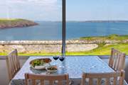 Watch the magnificent Pembrokeshire sunsets over dinner.