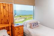 Haven High sleeps three with an option for a fourth person in this sweet coastal bedroom. Listen out for the sea crashing onto the rocks below.
