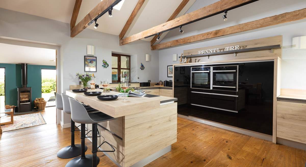 Step down from the kitchen to the sitting-room to admire the amazing views.