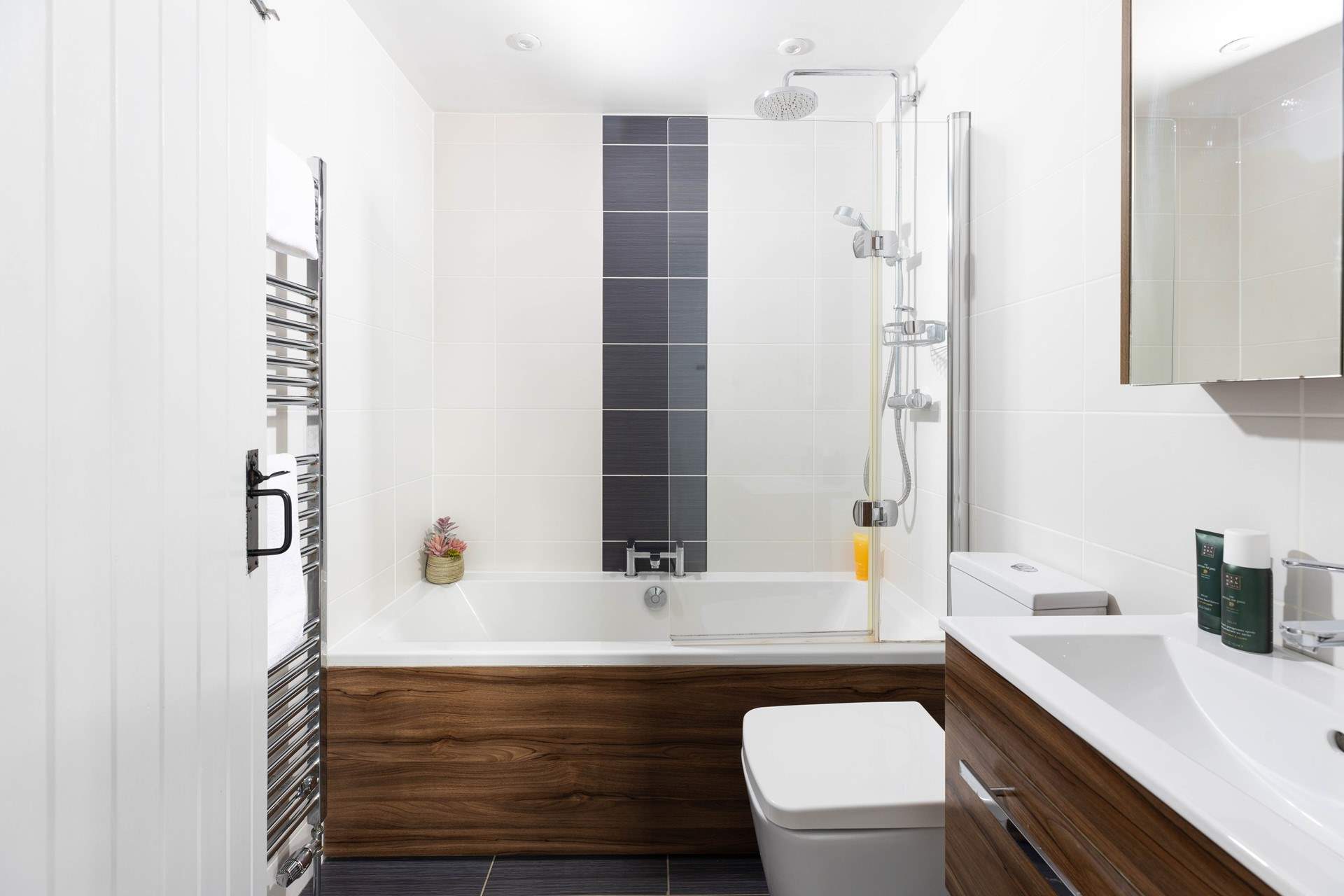 The family bathroom with overhead power shower.