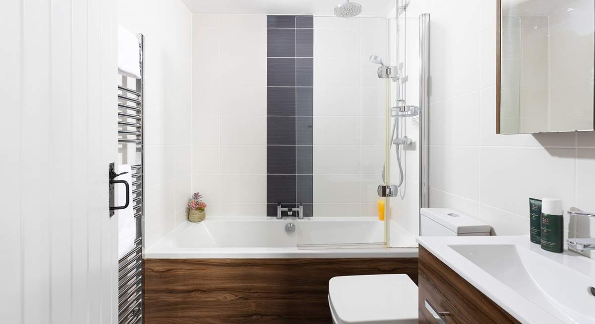 The family bathroom with overhead power shower.