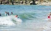 The turquoise waters of the West coast are perfect for body boarding. - Thumbnail Image