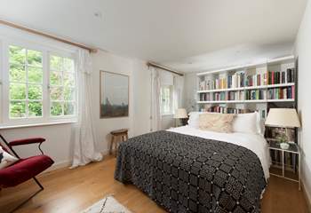 Snuggle under the covers of the king-size bed in the second bedroom.