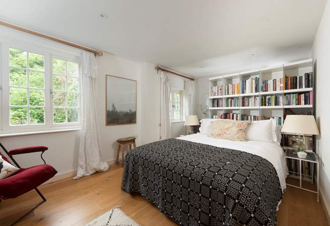 Snuggle under the covers of the king-size bed in the second bedroom.