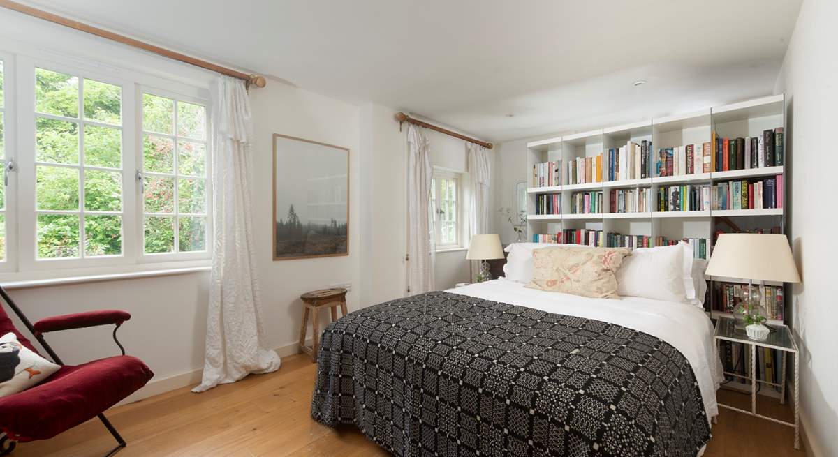 Snuggle under the covers of the king-size bed in the second bedroom.