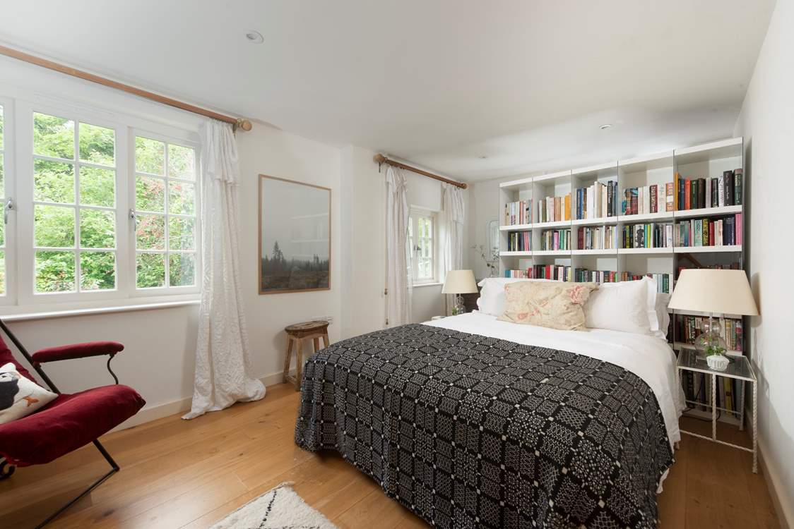 Snuggle under the covers of the king-size bed in the second bedroom.