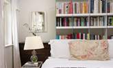 The second bedroom is a bookworm's delight! - Thumbnail Image