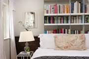 The second bedroom is a bookworm's delight!