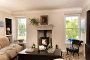 Cosy up with a book by the wood-burning stove.