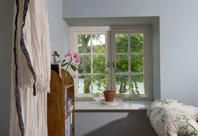Watch the comings and goings on the water from the bedroom.