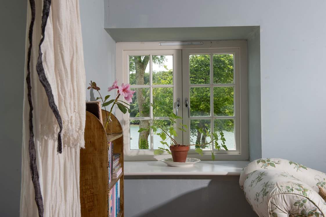 Watch the comings and goings on the water from the bedroom.