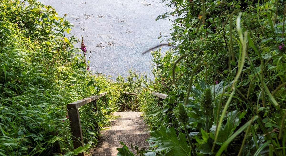 Steps lead down to your private quay.