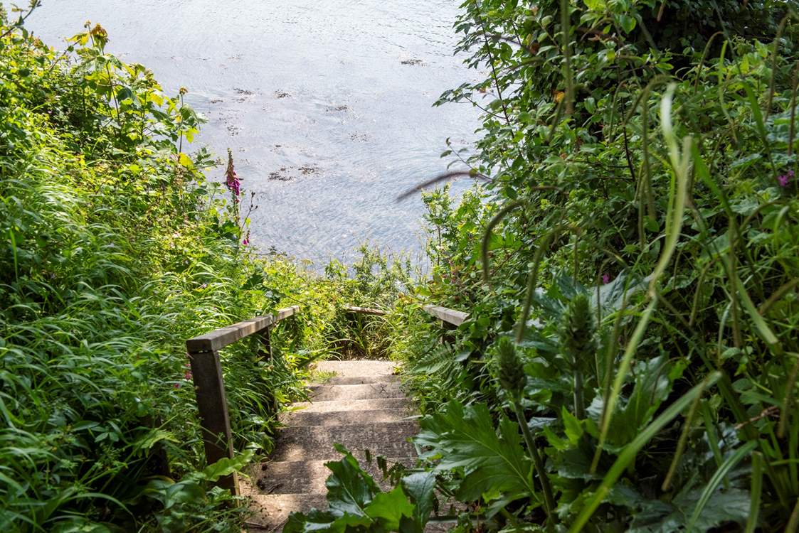 Steps lead down to your private quay.