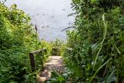 Steps lead down to your private quay.