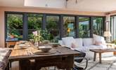 The large dining-table beckons you to enjoy leisurely brunches and delicious dinners.  - Thumbnail Image