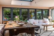 The large dining-table beckons you to enjoy leisurely brunches and delicious dinners.