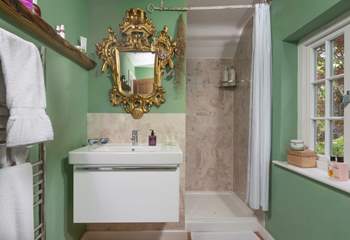 There's sense of grandeur in the en suite shower-room.