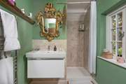 There's sense of grandeur in the en suite shower-room.
