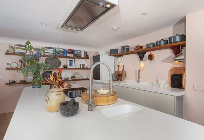 The kitchen island doubles up as a breakfast-bar, so pitch up for a morning cuppa or a glass of something chilled in the evening as you keep the designated chef company.