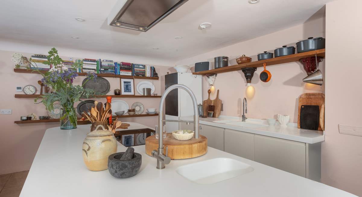 The kitchen island doubles up as a breakfast-bar, so pitch up for a morning cuppa or a glass of something chilled in the evening as you keep the designated chef company.