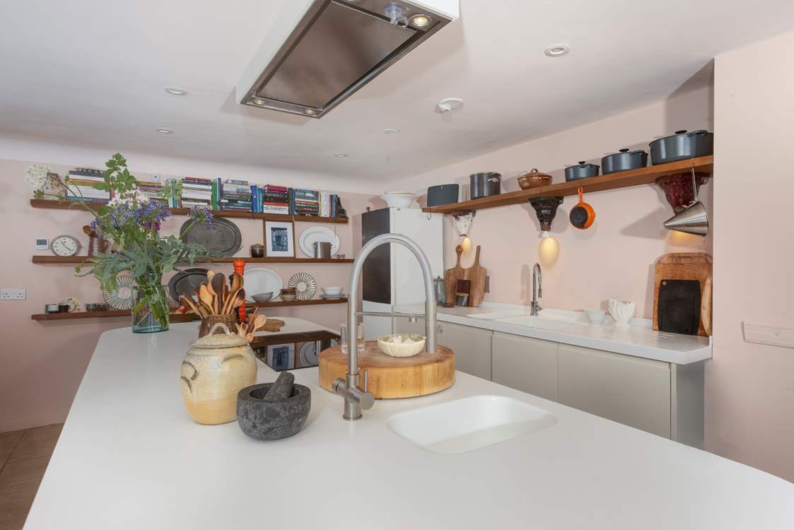 The kitchen island doubles up as a breakfast-bar, so pitch up for a morning cuppa or a glass of something chilled in the evening as you keep the designated chef company.