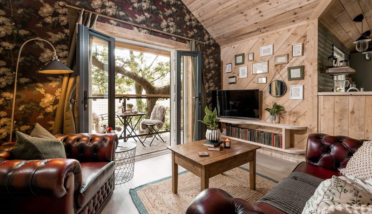 Open the double doors and let the dappled sunlight fill the open plan living space. 