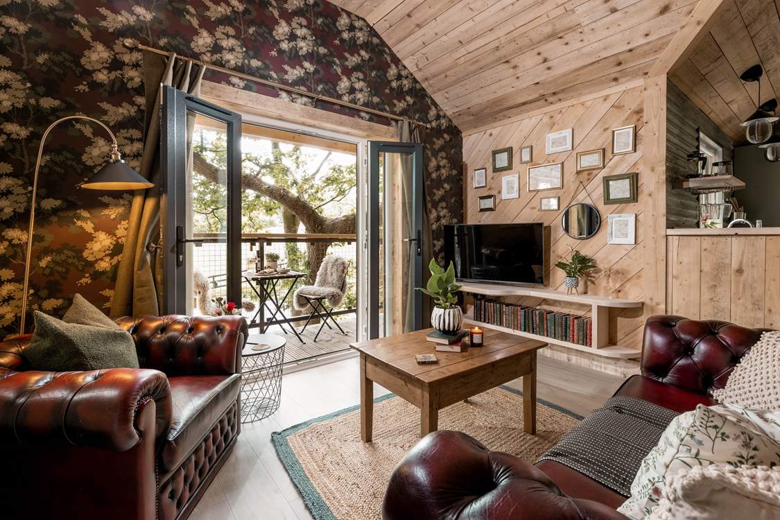 Open the double doors and let the dappled sunlight fill the open plan living space.