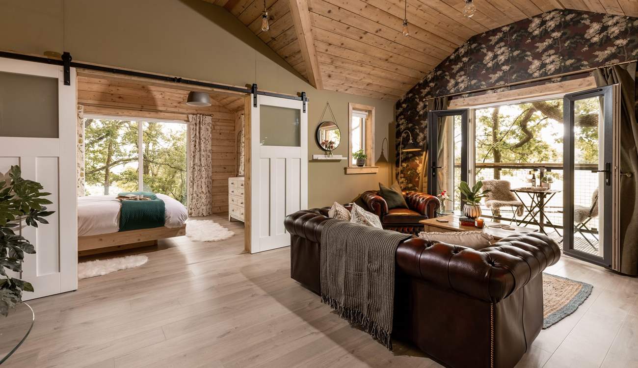Your day can flow with complete ease at this handcrafted house amongst the trees.