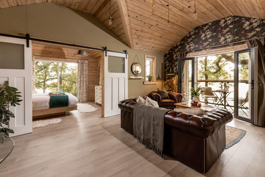 Your day can flow with complete ease at this handcrafted house amongst the trees.