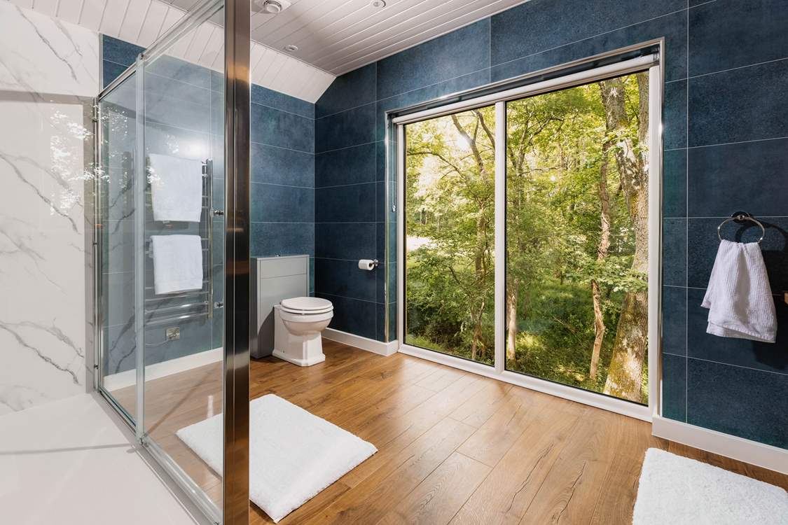 The outdoors is welcomed into every room, with large open windows.