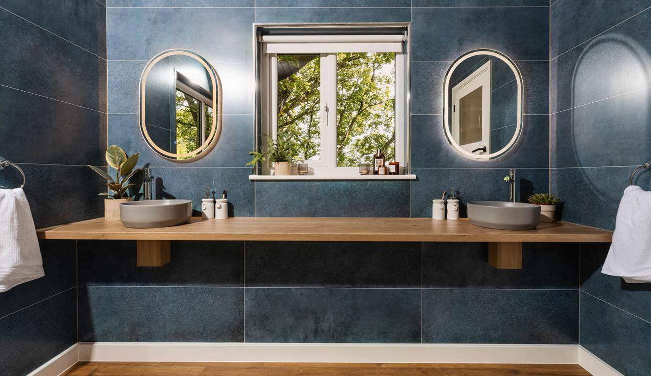 You'll find the lavish shower-room next door to the bedroom, which boasts a double sink set-up.