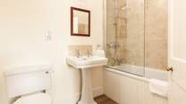 Enjoy a soak in the family bathroom.