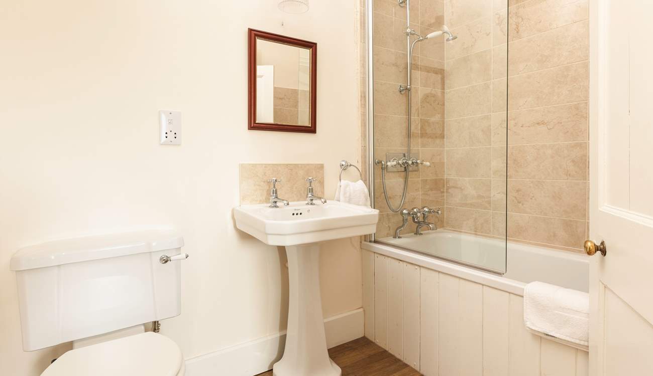 Enjoy a soak in the family bathroom.