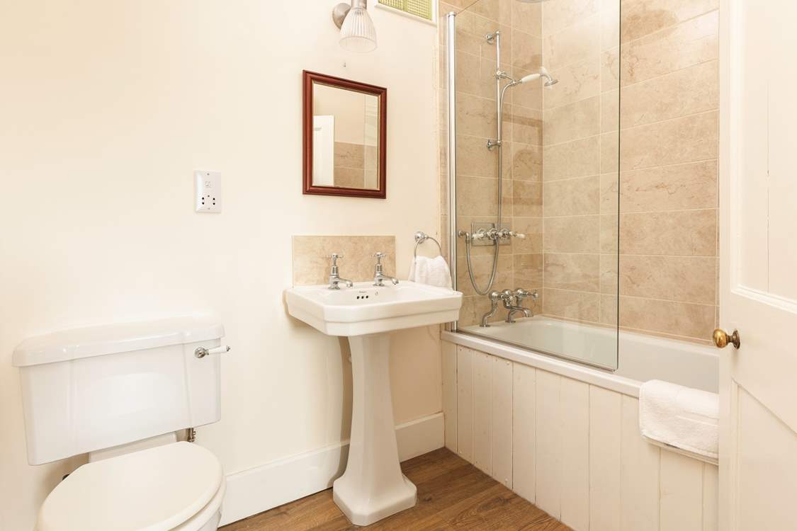 Enjoy a soak in the family bathroom.