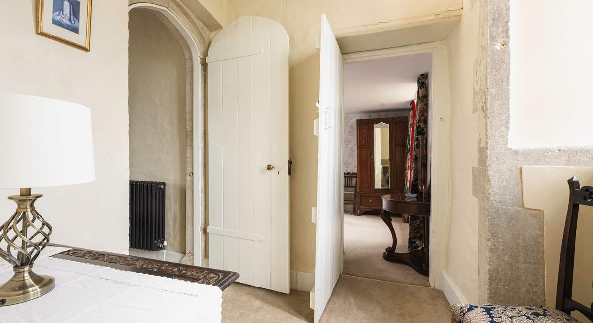 The bedroom leads off to a second staircase that takes you downstairs to the snug.