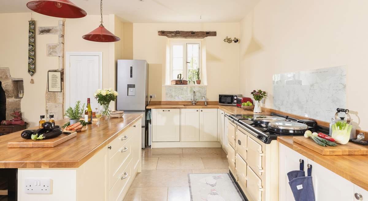 The kitchen adds a modern twist and the six door Aga is a lovely feature.