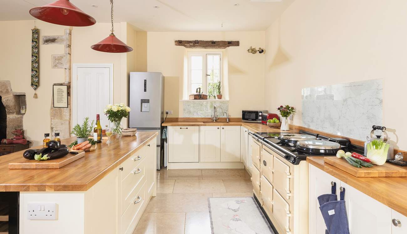 The kitchen adds a modern twist and the six door Aga is a lovely feature.