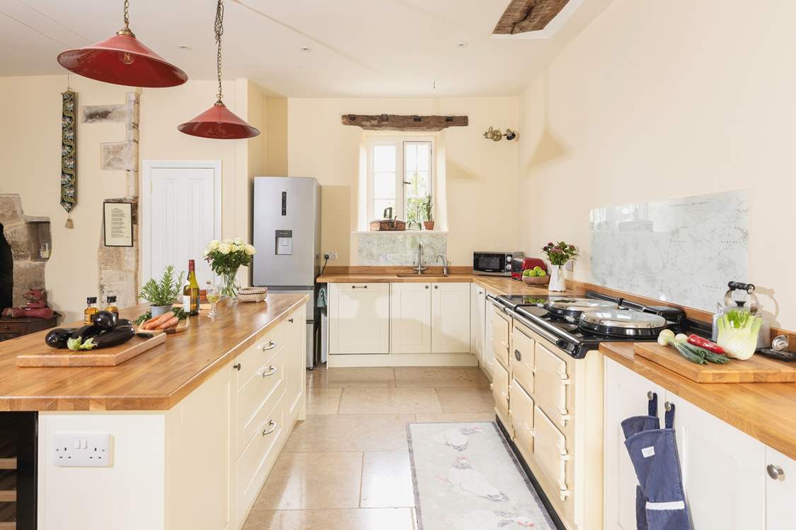 The kitchen adds a modern twist and the six door Aga is a lovely feature.