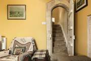 We just love the original narrow, stone arched doorways, more akin to what you might expect in a castle.