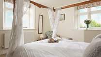 The double aspect windows offer delightful views of the gardens.