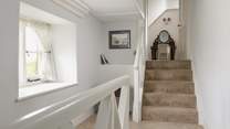 The second floor is split level, these steps lead to another spacious bedroom. 