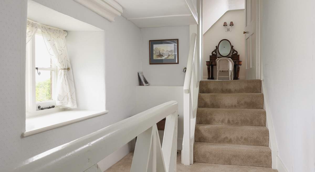 The second floor is split level, these steps lead to another spacious bedroom. 