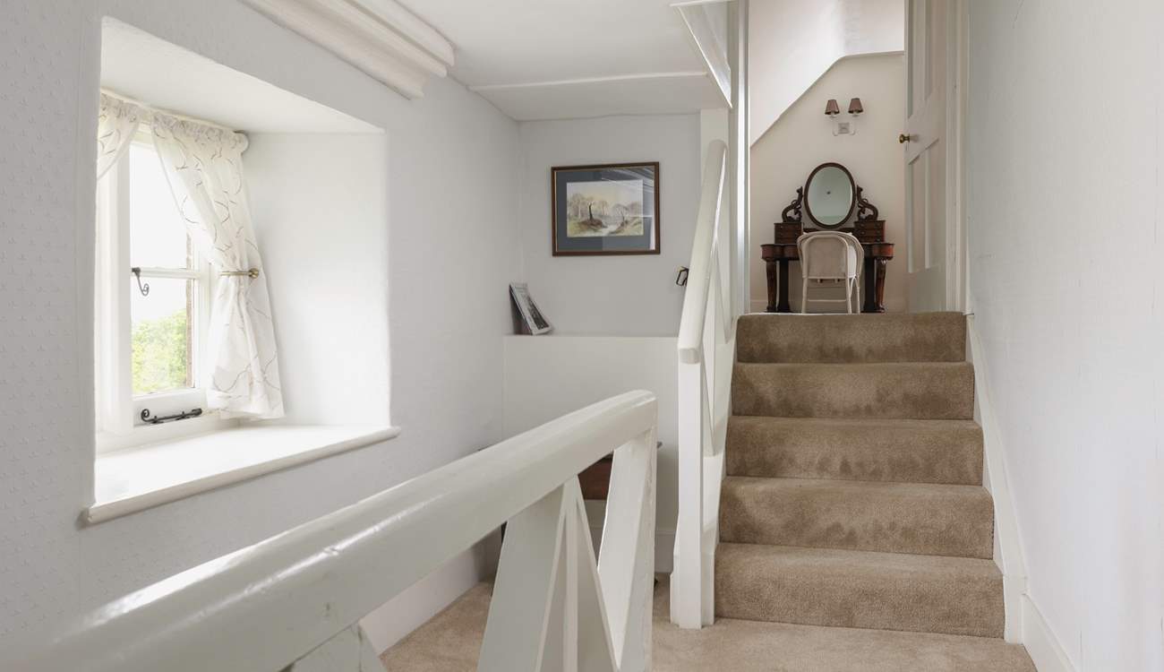 The second floor is split level, these steps lead to another spacious bedroom. 