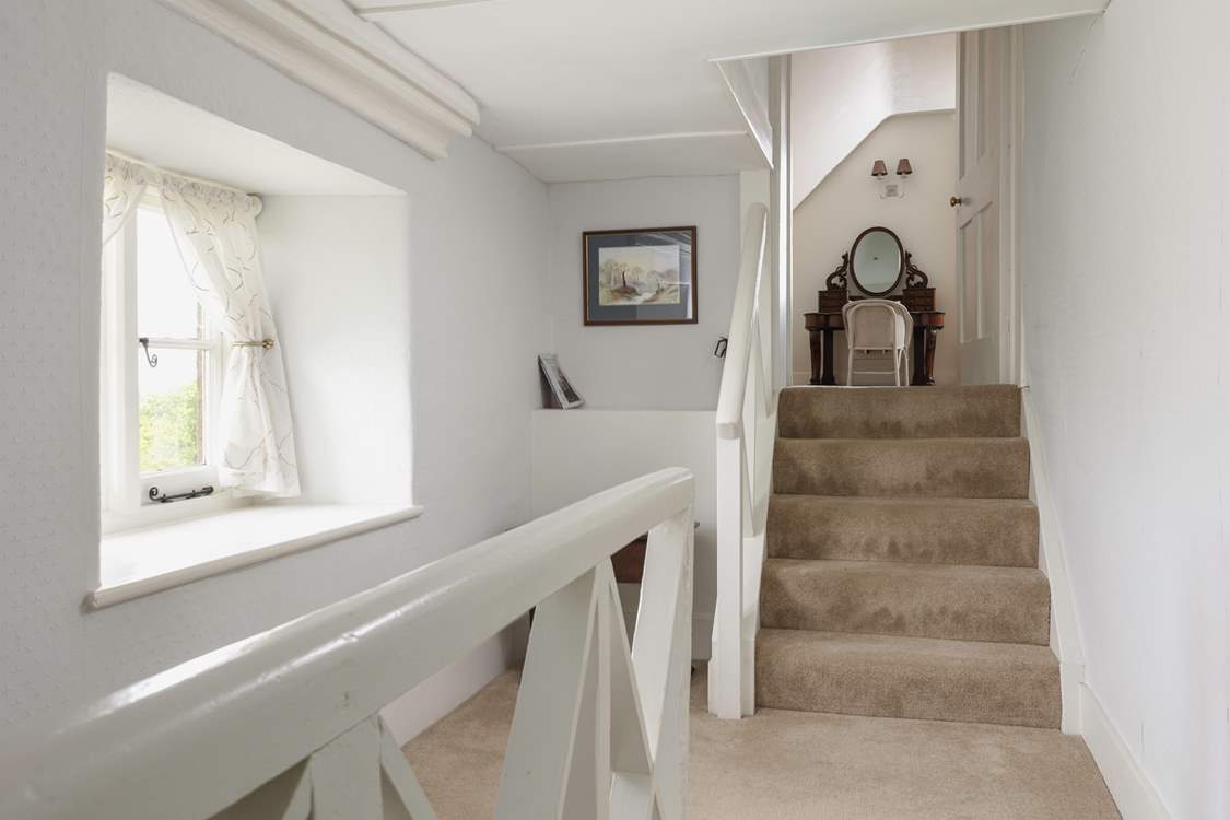 The second floor is split level, these steps lead to another spacious bedroom.