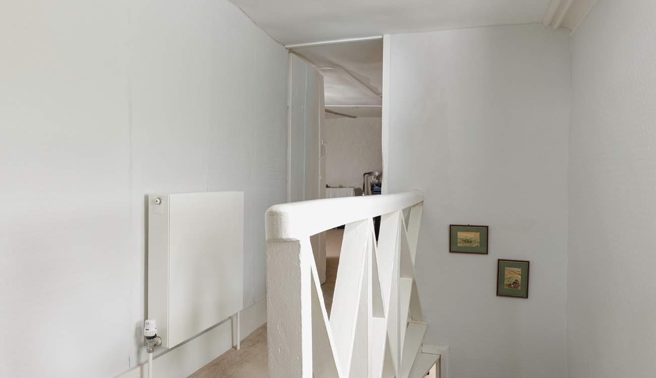 The lower second floor hall leads to the games-room.