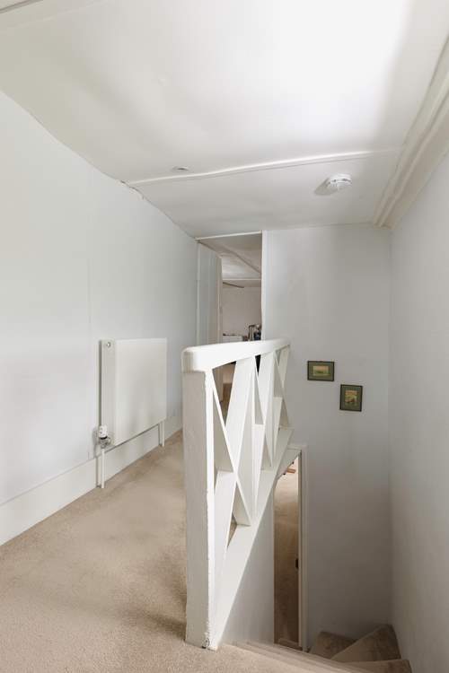 The lower second floor hall leads to the games-room.